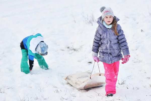 Little girl enjoying a sleigh ride — Stock Photo, Image