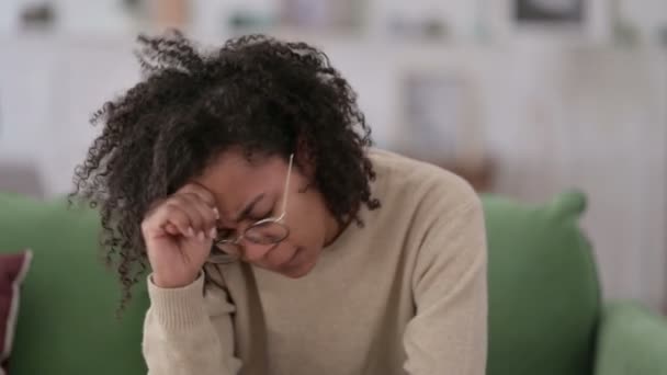 Stressed Young African Woman with Headache on Sofa — Stock Video