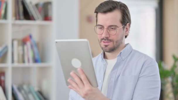 Portrait of Man in Glasses Celebrating Success on Tablet — Stock Video