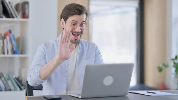 Man in Glasses Waving Hand for Video Call on Laptop — Photo