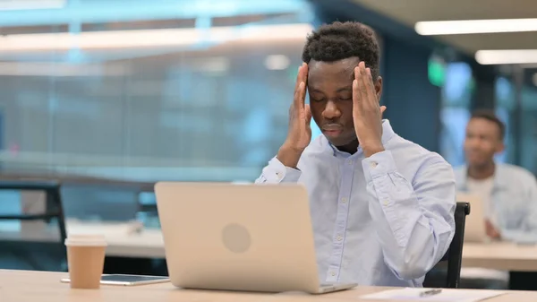 African Businessman with Laptop having Headache — Stock Photo, Image