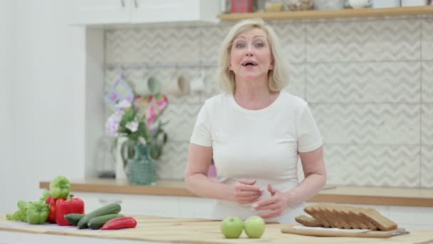 Loving Senior Old Woman Doing Video Call While Standing in Kitchen — Stock Video