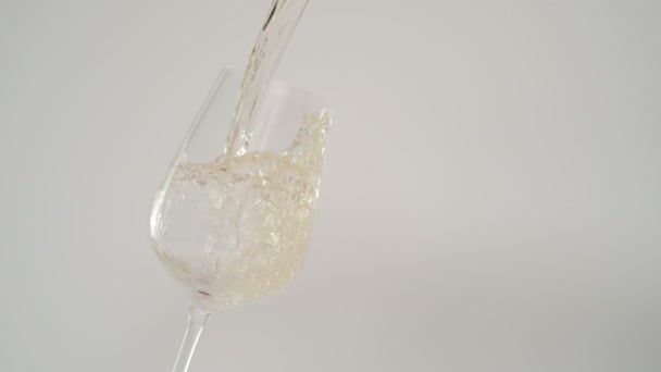 Slow Motion of White Wine Splashing in Tilted Transparent Glass at 1000 fps — Stock Video