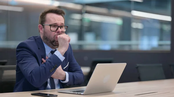 Middle Aged Businessman with Laptop Coughing — Stock Photo, Image