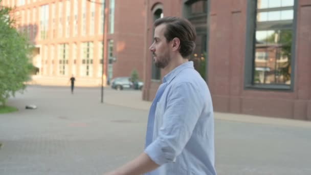 Side Pose of Man Walking in Empty Street in Slow Motion — Wideo stockowe