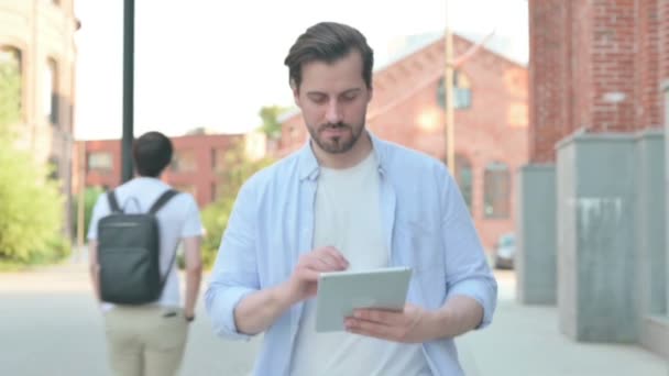 Man using Tablet while Walking in Slow Motion — Stock Video