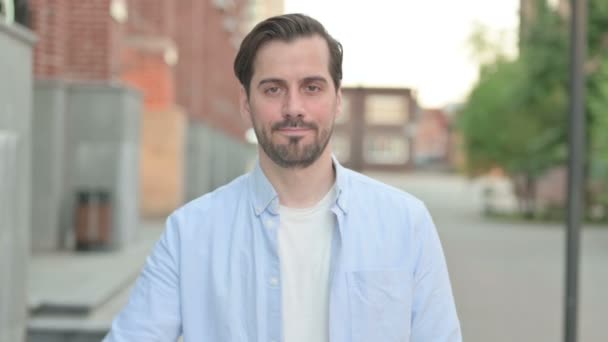 Man Showing Thumbs Down while Standing Outdoor — Stock Video