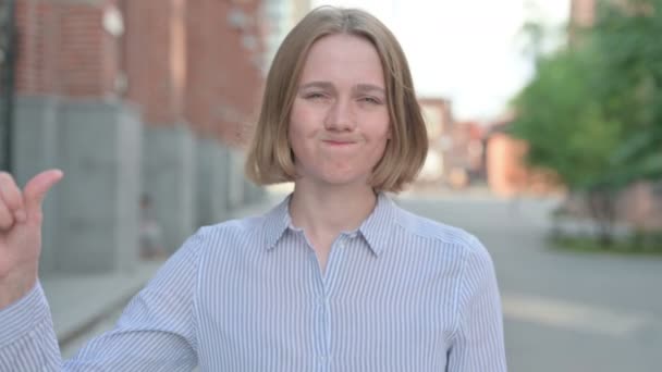 Portrait of Woman showing Thumbs Down Gesture, Outdoor — Stock Video