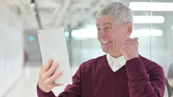 Middle Aged Businessman Celebrating Success on Tablet — Stock Photo, Image