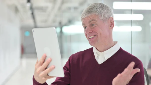 Middle Aged Businessman doing Video Chat on Tablet — Stock Photo, Image