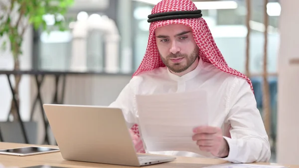 Arab Businessman working on Laptop with Documents in Office — Stock Photo, Image