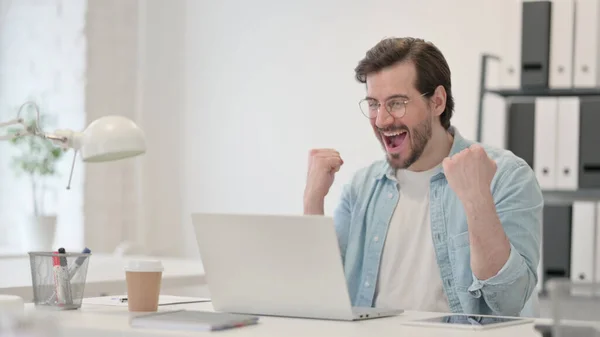 Successful Young Man Celebrating on Laptop at Work — Stock Photo, Image