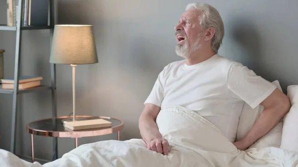 Tired Senior Old Man having Back Pain in Bed — Stock Photo, Image