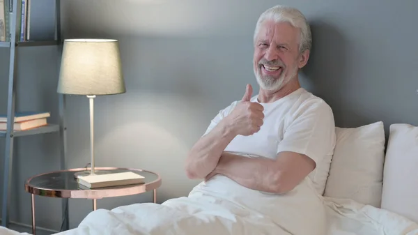 Thumbs Up by Senior Old Man Sitting in Bed, Appreciate