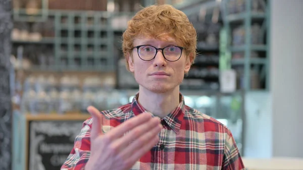 Portrait of Young Redhead Young Man Inviting People — Stock Photo, Image