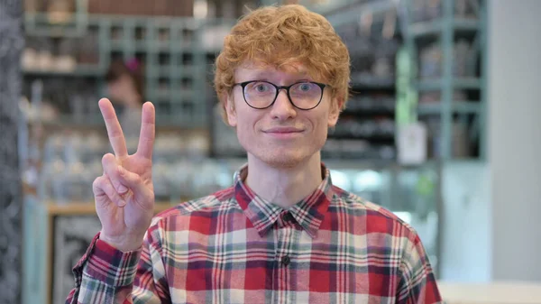 Portrait of Young Redhead Young Man with Victory Sign by Hand — Stock Photo, Image