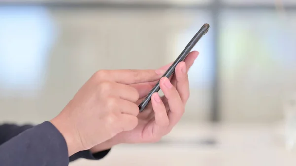 Close up of Female African Hands Browsing Internet on Smartphone — Stock Photo, Image