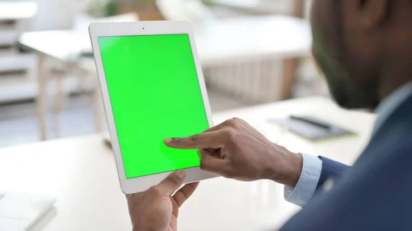African Businessman using Tablet with Green Chroma Key Screen — Stock Photo, Image