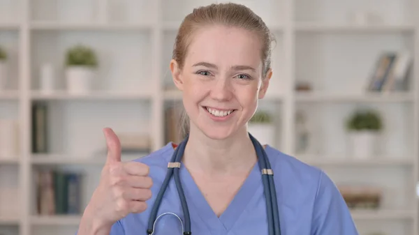 Cheerful Young Female Doctor doing Thumbs Up — Stock Photo, Image