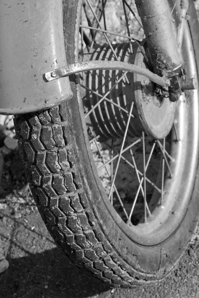 Close up of motorcycle wheel/ Black and white photo. Old vintage card. — Stock Photo, Image