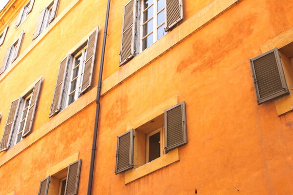 Windows of old house. Mediterranean architecture in Rome, Italy. European architecture.