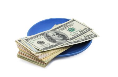 American dollars on blue plate isolated on white background