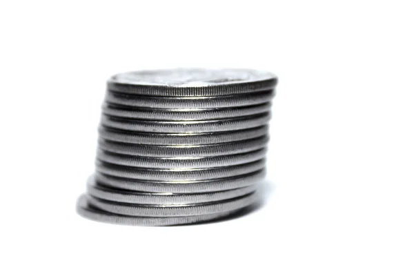 Монета стоїть ізольовано на білому — стокове фото