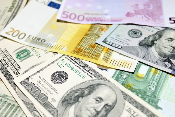 Υπόβαθρο του ευρώ και το δολάριο γραμμάτια. Ρηχά εστίαση. Royalty Free Εικόνες Αρχείου