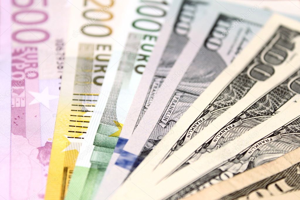 Background of euro and dollar bills. Shallow focus.