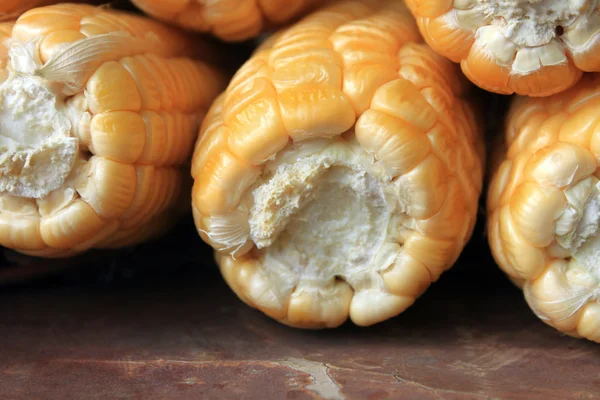 Ripe corn on brown background closeup — Stock Photo, Image