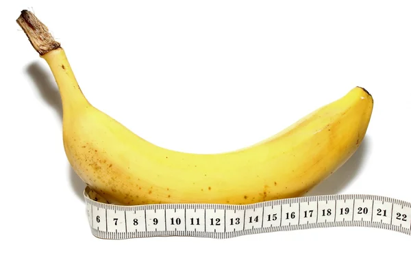 Banana grande e fita métrica Isolada no fundo branco, como o pênis grande do homem — Fotografia de Stock