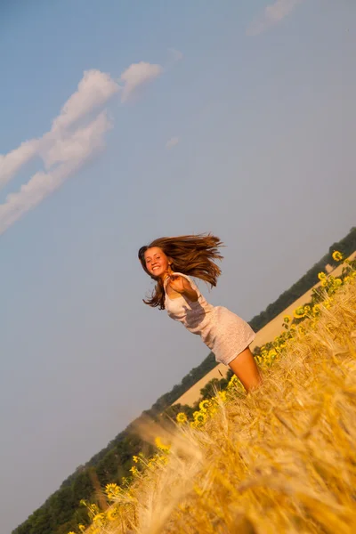 Happy young girl in field — Stock Photo, Image