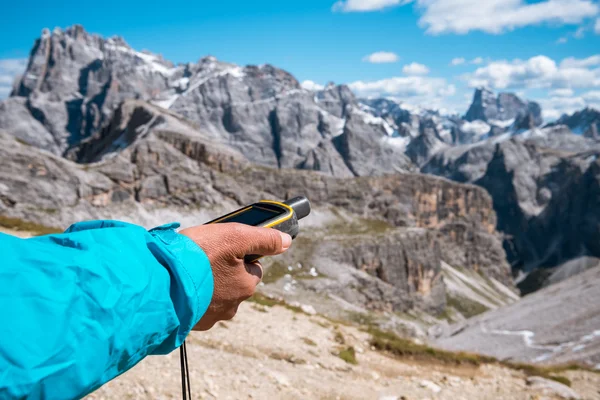 GPS navigator in hand Dolomites Alps — Stock Photo, Image