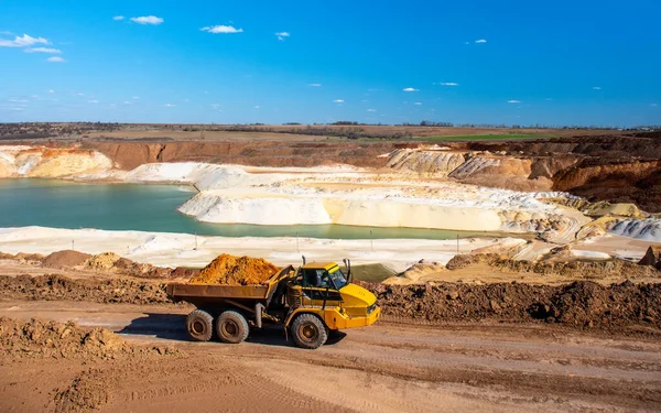 Big truck works at sand quarry