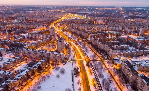 Aerial winter city view with roads, houses, buildings. Drone shot