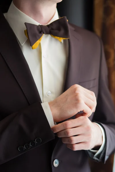 Bow tie and hands of young man closeup. — Stock Photo, Image