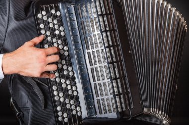 Musician playing accordion  clipart