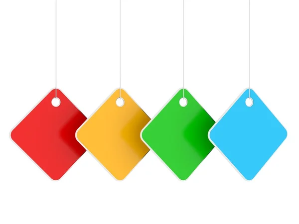 Four colored empty hanging labels — Stock Photo, Image