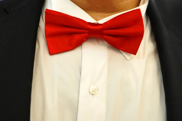 red bow tie on a white shirt close-up