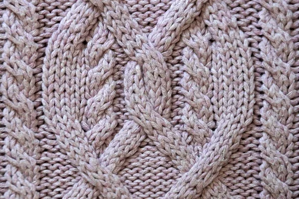 Pembe bir arka plan için el örgüsü.