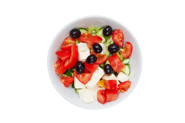 Gli ingredienti di taglio per insalata in piatti su uno sfondo bianco — Foto Stock