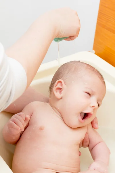 Newborn baby boy bathing — Stock Photo, Image