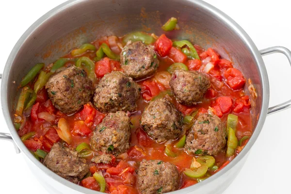 Meatballs cooking in a sauce — Stock Photo, Image