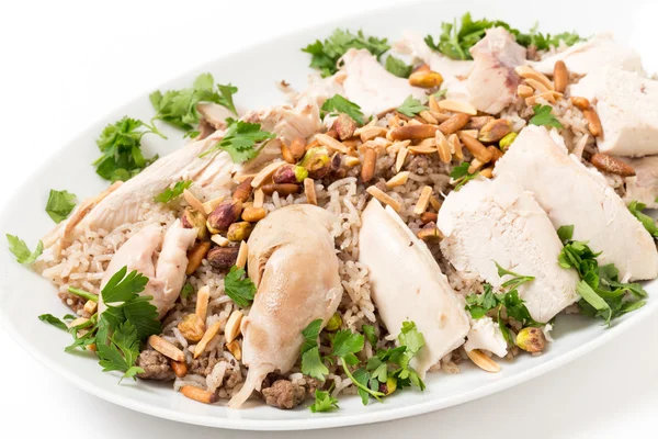 Lebanese chicken and spiced rice with nuts and parsley — Stock Photo, Image