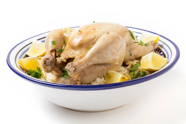 Chicken on pilaf rice in a Tunisian serving bowl — Stock Photo, Image