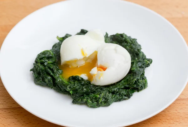 Boiled egg on spinach meal — Stock Photo, Image