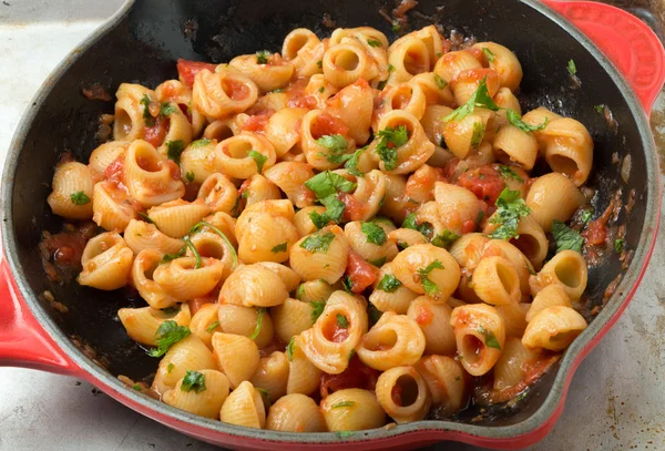 Elbow pasta arrabbiata mixed in a pan — Stock Photo, Image