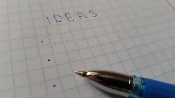 Woord Ideeën Geruit Papier Blauwe Pen — Stockfoto