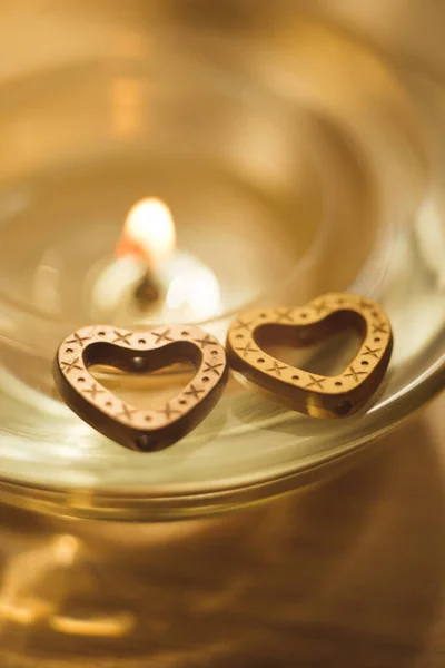 Two Metal Hearts Glass Candlestick Golden Candlelight — Stock Photo, Image