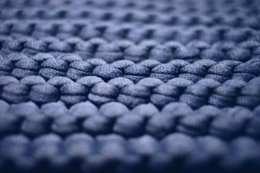 Soluk mavi arkaplan büyük örgü iplik deseni.